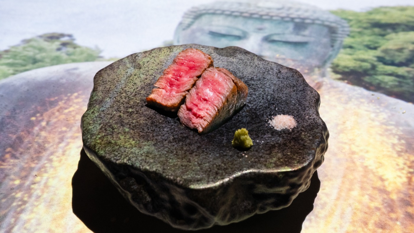 Charcoal-grilled Wagyu served on a stone plate in Shinjuku